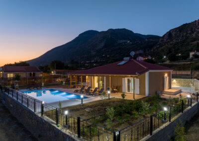 villa exterior design with swimming pool in sunset